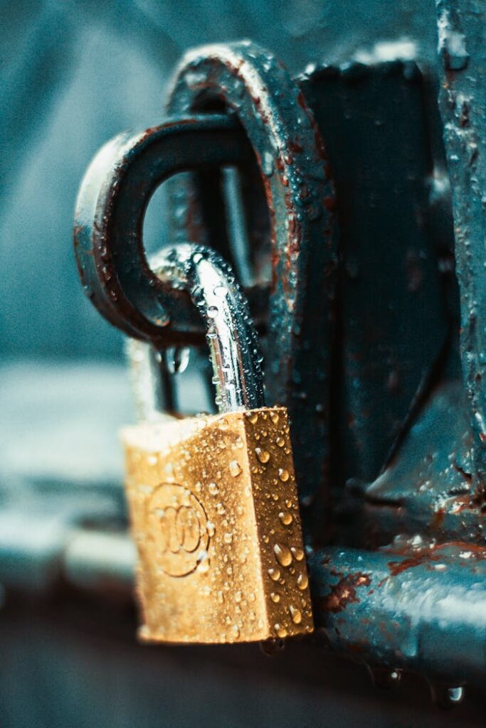 pexels-photo-1068349 Close-Up Photography of Wet Padlock